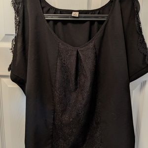 Black sleeveless blouse with lace inset